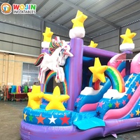 Château gonflable commercial thème Licorne, grande structure gonflable rose avec toboggan pour la location événementielle