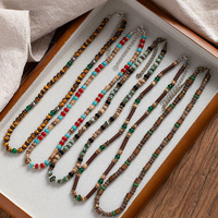 Collier ras du cou bohème vintage hawaïen pour homme, en pierres naturelles œil de tigre et turquoise, perles, style surf estival, avec coquille de noix de coco
