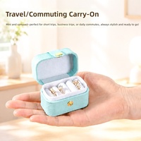 Boîte à bijoux de voyage ovale mini en cuir PU de luxe, personnalisable avec logo et bouton, pour bagues et boucles d'oreilles, vente en gros