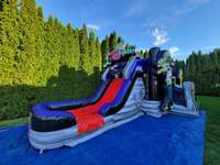 Château gonflable d'aventure à thème The Walking Dead 2026 avec toboggan et zone de saut pour la location