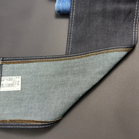 Tissu en jean bleu foncé vintage, mélange coton et élasthanne, texture slub, rouleaux de denim de haute qualité en gros