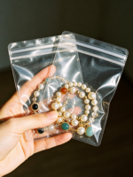 Pochette d'emballage transparente en plastique pour bijoux avec fermeture à bouton, estampage à chaud pour lunettes et bijoux, sac auto-scellant
