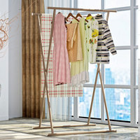 Vente en gros de supports portables pliables en métal à double pôle pour le séchage des vêtements d'intérieur et d'extérieur avec séchoir pour balcon et salle de bain