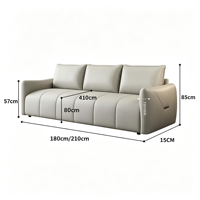 Canapé en cuir capitonné à cannelures, design droit avec dossier moelleux et coussin d'assise épais, pour la maison et l'appartement