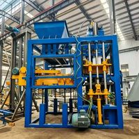 Machine de fabrication de blocs de béton hydraulique entièrement automatique QT4-15 pour la production de briques creuses, pleines, autobloquantes, pavés, en cendres volantes, ciment et argile