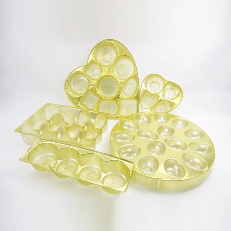 Di alta qualità cavità rotonda in plastica dorata cioccolato confezione scatola regalo con vassoio d'oro per animali domestici