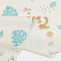 Vente en gros d'usine de tissu textile tricoté double matière, nouveau tissu imprimé en coton de dessin animé animal à la mode pour bébé/