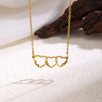 Collier tendance plaqué or avec pendentif cœur ajouré, bijou chic et à la mode pour femme, vente en gros TGXL14674