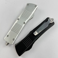 Couteau de camping portable à double lame rainurée Wjs-ut Dalong (noir et argent bicolore) avec lame à bouton-poussoir et manche usiné avec précision par CNC