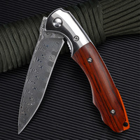 Couteau pliant portable noir imperméable d'extérieur avec acier Damas et manche en coquille blanche, personnalisable OEM pour le camping