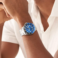 Montre de plongée pour homme en argent, cadran bleu, lunette rotative, affichage de la date, aiguilles lumineuses, bracelet en acier inoxydable, montre-bracelet sport à quartz
