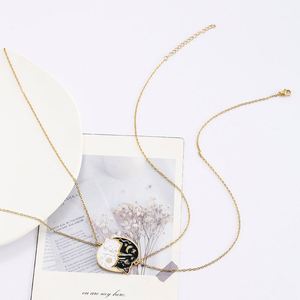 สร้อยคอคู่สแตนเลสสตีล ลายแมวสีดำขาว พระอาทิตย์ พระจันทร์ - Product Image 5
