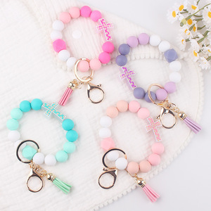 Nuovo Design colorato in Silicone con perline incrociate braccialetto UV stampato in gomma <span class=keywords><strong>portachiavi</strong></span> <span class=keywords><strong>per</strong></span> bambini e coppie con nappe regalo - Product Image 1