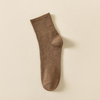 Chaussettes unisexes de haute qualité à prix de gros, logo personnalisé, couleur unie, chaussettes noires et blanches pour un usage quotidien