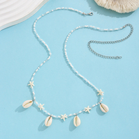 Chaîne de taille pour femme style bohème avec coquillages cauris, étoiles de mer, perles blanches et fermoir homard argenté – Cadeau
