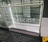Vitrine en verre en promotion pour magasin de tabac, avec éclairage coloré et cadre en aluminium verrouillable