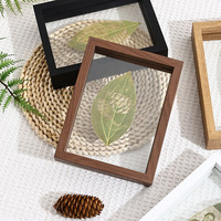 Nouveau modèle en gros, cadre photo en bois moderne double face, support de présentation paysager créatif avec sculpture de feuilles, cadre photo ajouré