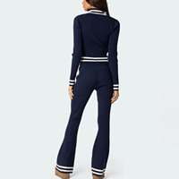 Ensemble coordonné zippé en maille pour femme avec broderie artisanale, coupe fluide et jambes larges, style survêtement raffiné