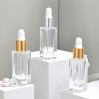 Flacon compte-gouttes carré en verre transparent pour sérum cosmétique et huile essentielle, avec bouchon doré ou argenté, logo personnalisé, vente en gros