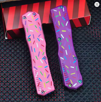 Couteau de poche à double action 9000, manche en alliage de zinc rose avec motif de beignets colorés, lame recouverte de Cerakote bleu, outil de coupe EDC
