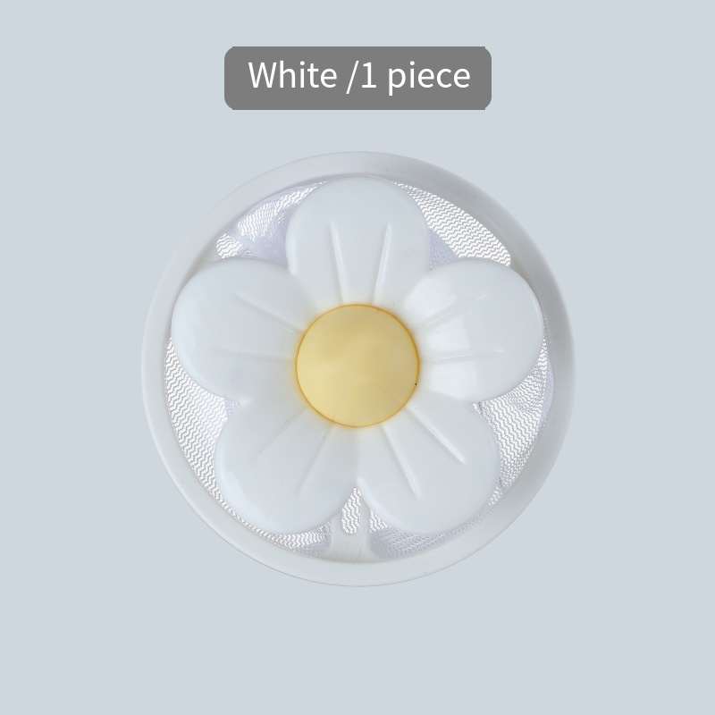Filtro para lavadora con diseño de flor blanca.