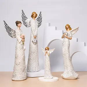 Cross-border creative new doll resin crafts angel combination flower bouquet pigeon iron wings design character modeling