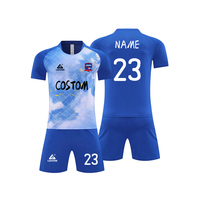 Ensemble d'uniformes de football personnalisés, imprimé effet encre, manches raglan, maillot et short multicolores