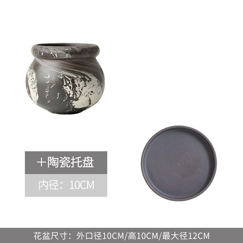 Petit pot de fleur rond en terre noire avec plateau