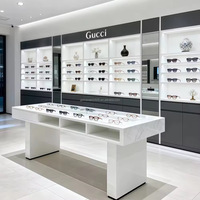 Comptoir d'exposition moderne de luxe en acier inoxydable avec éclairage LED, marque Maxsen, options or/noir pour lunettes haut de gamme sur mesure