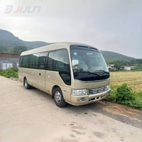 Coaster Bus 4 cylindres d'occasion avec moteur diesel 23-29 places Transmission manuelle avec porte battante en bon état