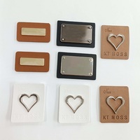 Étiquettes de vêtements en cuir noir écologiques personnalisées avec logo personnalisé et patchs en métal embossés