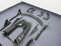 Kit carrosserie style DK en fibre de carbone sèche : Lame avant, jupes latérales, diffuseur, aileron arrière, capot moteur pour mise à niveau Lamborghini Revuelto