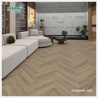 Plancher en bois à chevrons de 7mm personnalisable SPC résistant à l'usure et à l'humidité