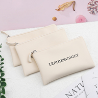 Logo personnalisé blanc PU fermeture éclair pièce de monnaie sac d'emballage en gros cosmétique fermeture éclair Pu pochette en cuir