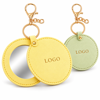 Miroir de maquillage rond en cuir PU avec logo personnalisé, poche simple face, couvercle rotatif et clip porte-clés pour sacs à main