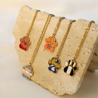 Collier chaîne clavicule en acier inoxydable avec pendentif patte de chat mignon et design, motif empreinte animale, finition goutte d'huile, cadeau unisexe