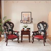 Fauteuil de loisirs en cuir véritable de première qualité de style européen avec accoudoirs sculptés et petite table intégrée pour salon et bureau