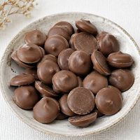 Boutons de chocolat au lait de qualité supérieure à texture lisse pour garnitures de pâtisseries, gâteaux et confiseries à faire fondre