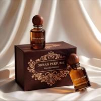 Emballage de luxe personnalisé pour flacons de parfum vides en ambre de 30 ml, 50 ml, 100 ml, cylindriques, portables, avec atomiseur et bouchon.