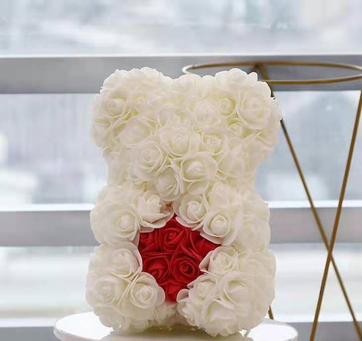 thin white bear with red heart with box