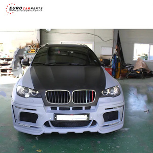 Kit carrosserie complet en PP pour BMW X6 Série <span class=keywords><strong>E71</strong></span> (modèles 2015-2016) style HM, comprenant pare-chocs avant, diffuseur arrière, extensions d'ailes et jupes latérales. - Product Image 1
