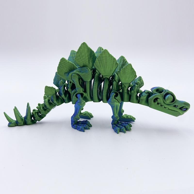 Estegosaurio azul verdoso de 18 cm de largo.