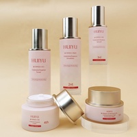 Bel emballage cosmétique rond ensemble de bouteilles en verre bouteilles de soins de la peau roses avec couvercle