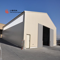 Bâtiment préfabriqué économique et résistant au vent pour le transport de marchandises commerciales, entrepôt à structure en acier