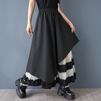 Nouvelle Robe d'été 2026 en gros pour femme, coupe trapèze asymétrique, patchwork en maille, taille haute, ample, noire, style chic français, coupe irrégulière
