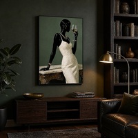 Décoration murale encadrée en alliage noir mat, motif silhouette féminine africaine style bohème, pour la rénovation de propriétés en location courte durée et l'aménagement d'espaces à usage intensif