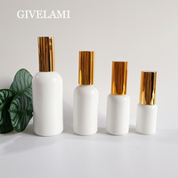 Vente en gros de flacons pulvérisateurs en verre transparent blanc de forme ronde de 15 ml, 30 ml, 50 ml, 100 ml avec pulvérisateur doré