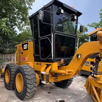 Niveleuse Caterpillar 12G d'occasion, modèle 2023, moteur Cat 3306, 150-160 CV, origine USA, pompe de construction robuste