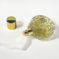 Bouteille de parfum ronde transparente pour voiture Bouteille de parfum en verre gaufré Nouveau design Conteneur cosmétique Bouteille de parfum vide 50ml