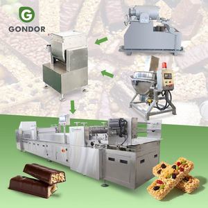 Machine de moulage et de découpe pour barres protéinées, barres énergétiques et barres de graines, à base de maïs cru et de céréales, pour la production de produits sains - Product Image 1